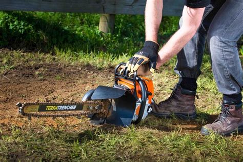 digging a trench with a mini excavator|small powerful handheld trenchers.